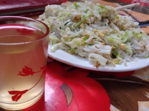 Brunch of stir fried egg, veggies and rice noodles, a  side of apple wine with a couple of wee flies.