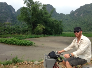 Leprechaun husband biking outside Ninh Binh before the rain storm forced us inside for a beer.